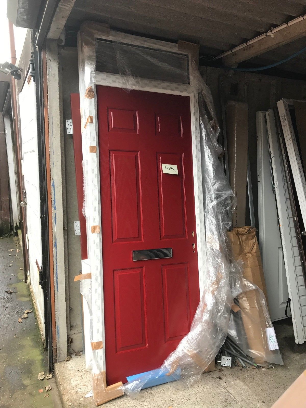 Hormann ThermoComp TR01 with Fanlight in Signal Red